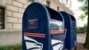 FILE - A Priority Mail Express collection bin is seen near the Trump International Hotel in Washington, Aug. 22, 2020. 