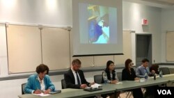 Ellen Werner enjoys the snow-covered landscape following an early spring snowstorm that dumped several inches of heavy, wet snow, in Freeport, Maine.