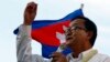 In this file photo taken on Dec. 22, 2013, Cambodian opposition leader Sam Rainsy of the Cambodia National Rescue Party delivers a speech before his party supporters during a rally in Phnom Penh, Cambodia.