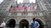 FILE - Law enforcement officers stand guard in front of the Trump Hotel in Washington, June 30, 2018.