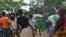 A group of young girls in Malawi at a basketball court in Blantyre. (Lameck Masina for VOA News)