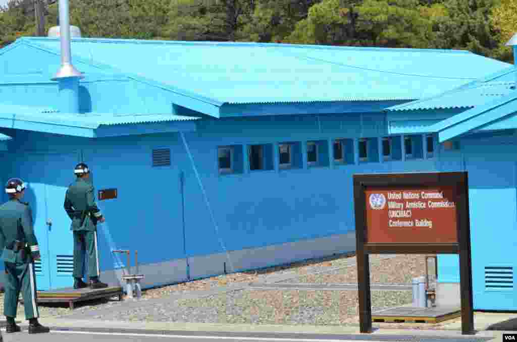 Two South Korean soldiers outside the T1 building which straddles South and North Korea, April 17, 2013. (VOA/S. Herman) 
