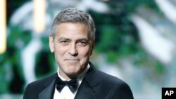 U.S. actor George Clooney speaks on stage prior to receiving an Honorary Cesar award during the ceremony of 42nd Cesar Film Awards, at the Salle Pleyel, in Paris, France, Feb. 24, 2017. 