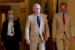 Senate Minority Leader Mitch McConnell of Kentucky walks towards the Senate chamber in Washington, Aug. 9, 2021.