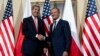 U.S. Secretary of State John Kerry (L) shakes hands as he meets with Polish Prime Minister Donald Tusk in Warsaw, Nov. 5, 2013. 