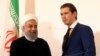 El presidente iraní, Hassan Rouhani, estrecha la mano del canciller de Austria, Sebastian Kurz, en la cancillería federal de Viena, Austria, el miércoles 4 de julio de 2018. (AP Photo / Ronald Zak). La UE implementará el martes 7 de agosto de 2018 una ley para proteger a las empresas europeas de los efectos extraterritoriales de las sanciones de EE.UU. a Irán.