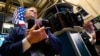 Traders work on the floor of the New York Stock Exchange August 1, 2013.
