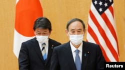 资料照：日本首相菅义伟和外务大臣茂木敏充在东京首相府会晤到访的美国国务卿布林肯期间。（2021年3月16日）