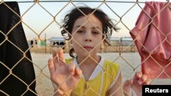 A Syrian refugee is pictured at the Al Zaatri refugee camp in the Jordanian city of Mafraq, near the border with Syria, July 31, 2012. 