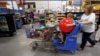FILE - A family shops at a Wal-Mart Supercenter store in Springdale, Arkansas, June 4, 2015.