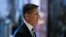 FILE - Michael Flynn walks through the lobby at Trump Tower in New York, Nov. 17, 2016. 