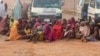 Women and children who were kidnapped in the northwestern state of Zamfara sit after being rescued by the Nigerian security agents in Zamfara, Nigeria, October 7, 2021.