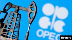 FILE PHOTO: A 3D-printed oil pump jack in front of the OPEC logo in this illustration picture