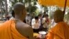 Cambodian Buddhist monks bless to Buddhist followers near Bayon temple in Siem Reap province, about 320 kilometers (199 miles) north of Phnom Penh, Cambodia, Tuesday, April 27, 2010. Cambodia marks Buddha's birthday, Visakha Bochea, on April 28 in the Ang