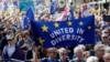 Anti Brexit campaigners carry flags and banners as they march towards Britain's parliament in London, March 25, 2017. Britain's Prime Minister Theresa May is expected to start the process of leaving the European Union March 29. 