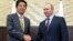 Japan's Prime Minister Shinzo Abe, left, and Russian President Vladimir Putin meet in Sochi, Russia, May 6, 2016.