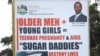 FILE - A billboard highlighting the dangers of young women being lured into sex with older men is seen in Durban, South Africa.