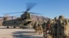 FILE - U.S. soldiers load onto a Chinook helicopter to head out on a mission in Afghanistan, Jan. 15, 2019.