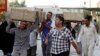 Bombing victims are taken for burial in the Shi'ite holy city of Najaf, Sept. 15, 2013.