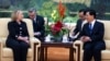 U.S. Secretary of State Clinton speaks with Chinese President Hu Jintao during their meeting at the Great Hall of the People in Beijing, Sept. 5, 2012. 