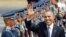 U.S. President Barack Obama waves to the media upon arrival Monday, April 28, 2014 at the Ninoy Aquino International Airport in Manila, Philippines. Trade and security are expected to be discussed in Obama's state visit to the Philippines. (AP Photo/Bulli