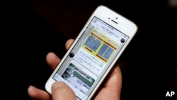 FILE - An Iranian man shows Telegram app messages on his mobile phone in Tehran, Feb. 24, 2016. 