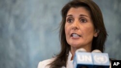 Visitors view seasonal cherry blossoms from a pedestrian bridge in the Roppongi district in Tokyo, Japan.