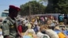 FILE - Refugees from Central Africa Republic wait for a food distribution at an UNHCR refugee camp in the eastern Cameroonian city of Garoua-Boulai, not far from the border with Central Africa Republic, March 13, 2014. 