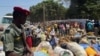 FILE - Refugees from Central Africa Republic wait for a food distribution at an UNHCR refugee camp in the eastern Cameroonian city of Garoua-Boulai, not far from the border with Central Africa Republic, March 13, 2014. 