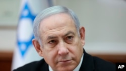 Israeli Prime Minister Benjamin Netanyahu attends the weekly cabinet meeting at his office in Jerusalem, Dec. 1, 2019. 