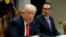 FILE - Treasury Secretary Steven Mnuchin listens at right as President Donald Trump speaks during a meeting on the Federal budget, Feb. 22, 2017, in the Roosevelt Room of the White House in Washington.