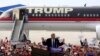 Secret Service agents surround U.S. Republican presidential candidate Donald Trump during a disturbance as he speaks at Dayton International Airport in Dayton, Ohio, March 12, 2016.