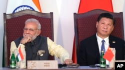 মিয়ানমারে ভু-রাজনৈতিক প্রতিযোগিতাঃ ভারতীয় প্রধানমন্ত্রী নরেন্দ্র মোদী এবং চীনের প্রেসিডেন্ট শি জিনপিং। ফটোঃ ১৬ অক্টোবর, ২০১৬।