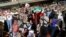 Iranian football supporters — men and women alike — cheer for their national team during a screening of the Russia 2018 World Cup Group B football match between Iran and Spain in Azadi stadium in Tehran, June 20, 2018.