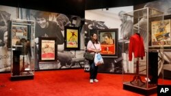 A visitor scans items on display at "Graceland Presents Elvis: The Exhibition" at the Westgate Las Vegas Resort and Casino, April 23, 2015.