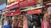 Shops in a Delhi market gear up to open, June 7, 2021, after a devastating second wave shut the city for nearly two months. (Anjana Pasricha/VOA)