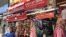 Shops in a Delhi market gear up to open, June 7, 2021, after a devastating second wave shut the city for nearly two months. (Anjana Pasricha/VOA)