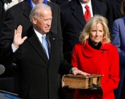 FILE - U.S. Vice President Joe Biden is sworn in as his wife Jill Biden watches during the inauguration of President Barack Obama in Washington, Jan. 20, 2009.