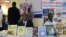 Participants are seen behind a display at the Mogadishu Book Fair in Mogadishu, Somalia. (Courtesy - Mogadishu Book Fair)