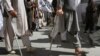 FILE - Accommodations for the disabled are rare in Pakistan. In this file photo, Afghan disabled men march during a demonstration in Kabul, Afghanistan, July 2, 2011.