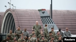 U.S. soldiers wait for a speech by U.S. President Donald Trump as he meets U.S. troops based in Osan Air Base, South Korea, June 30, 2019.
