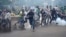 Protesters, rallying against what they see as a biased electoral commission, run away from police during clashes in Nairobi, Kenya, May 16, 2016. The country is scheduled to hold presidential and parliamentary elections in August 2017.