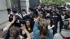 FILE - Friends and family greet a procession of students in the graduating class of 2012 at Princeton University on June 5, 2012. 