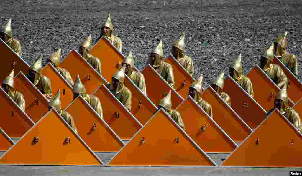 Servicemen in festive costumes get ready to perform at the opening ceremony of the International Army Games 2016 at Gvardeisky Range, Kazakhstan, August 2, 2016.
