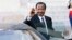 FILE - Cameroon President Paul Biya waves to reporters as he gets into his car after a meeting at the Elysee Palace, in Paris, May 17, 2014.
