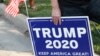 A supporter of US President Donald Trump holds a sign to show their support before the vice presidential debate outside Kingsbury Hall at the University of Utah on October 7, 2020, in Salt Lake City, Utah. (Photo by GEORGE FREY / AFP)