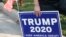 A supporter of US President Donald Trump holds a sign to show their support before the vice presidential debate outside Kingsbury Hall at the University of Utah on October 7, 2020, in Salt Lake City, Utah. (Photo by GEORGE FREY / AFP)