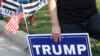 A supporter of US President Donald Trump holds a sign to show support before the vice presidential debate outside Kingsbury Hall at the University of Utah on Oct. 7, 2020, in Salt Lake City, Utah.