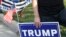 A supporter of US President Donald Trump holds a sign to show support before the vice presidential debate outside Kingsbury Hall at the University of Utah on Oct. 7, 2020, in Salt Lake City, Utah.
