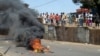 Anti-government protesters set fire during clashes with Guinea security forces in Conakry, February 27, 2013.